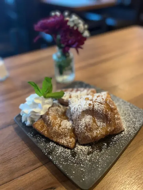 Traditional Mexican sopapilla dessert dusted with cinnamon sugar, served at Casa Real